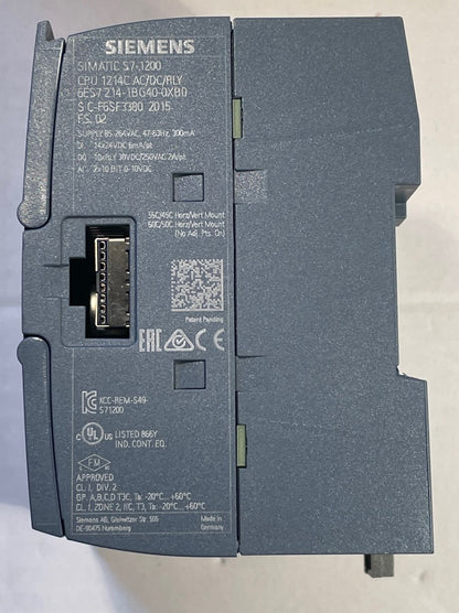 A Siemens SIMATIC S7 1200 CPU module, model CPU 1214 AC/DC DR/Y DR, part number 6FG57390 2015, shown from the back side with the connector terminal block visible.