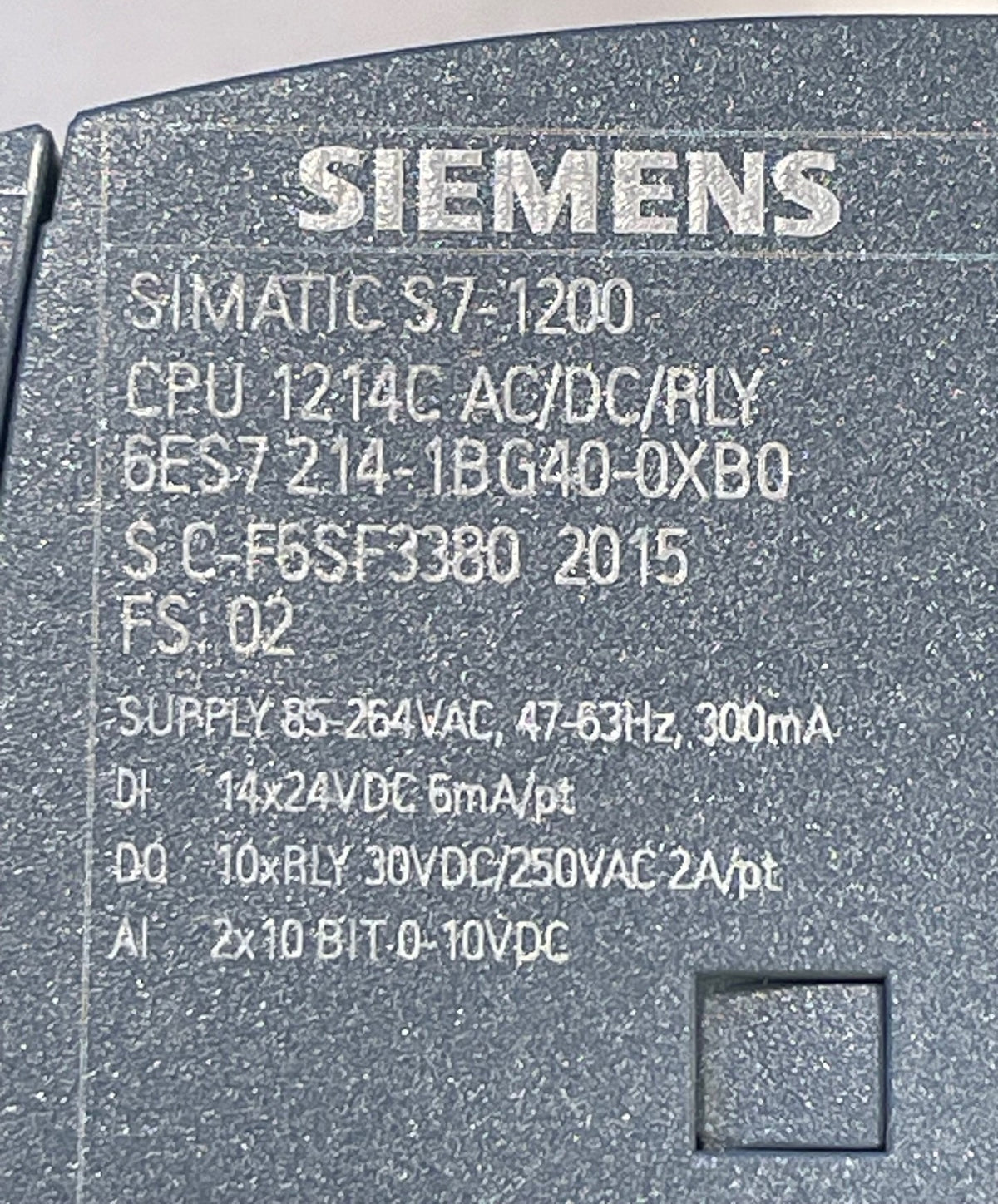 Close-up of the back of a Siemens SIMATIC S7-1200 industrial controller showing technical specifications printed in white on a dark gray textured surface.