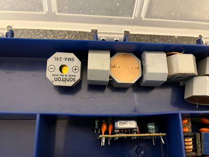 Double-Sided Organizer Box with Assorted Capacitors, IC Chips, and Electronics